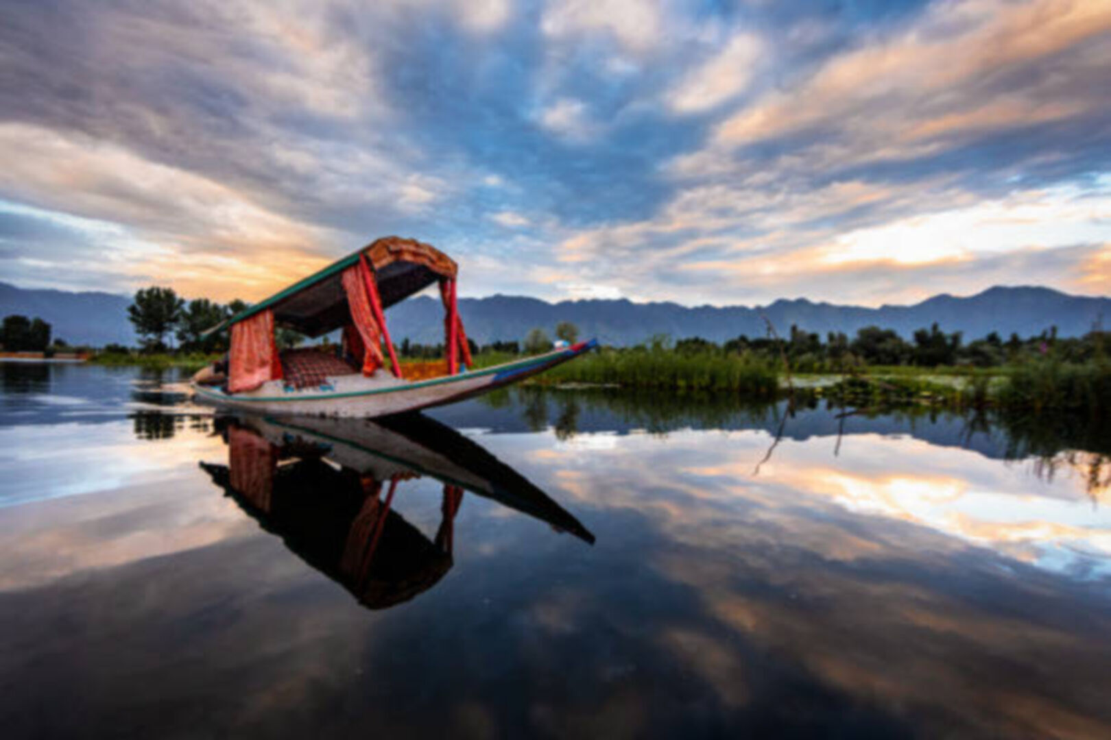 Family enjoying shikara ride on Dal Lake Kashmir
