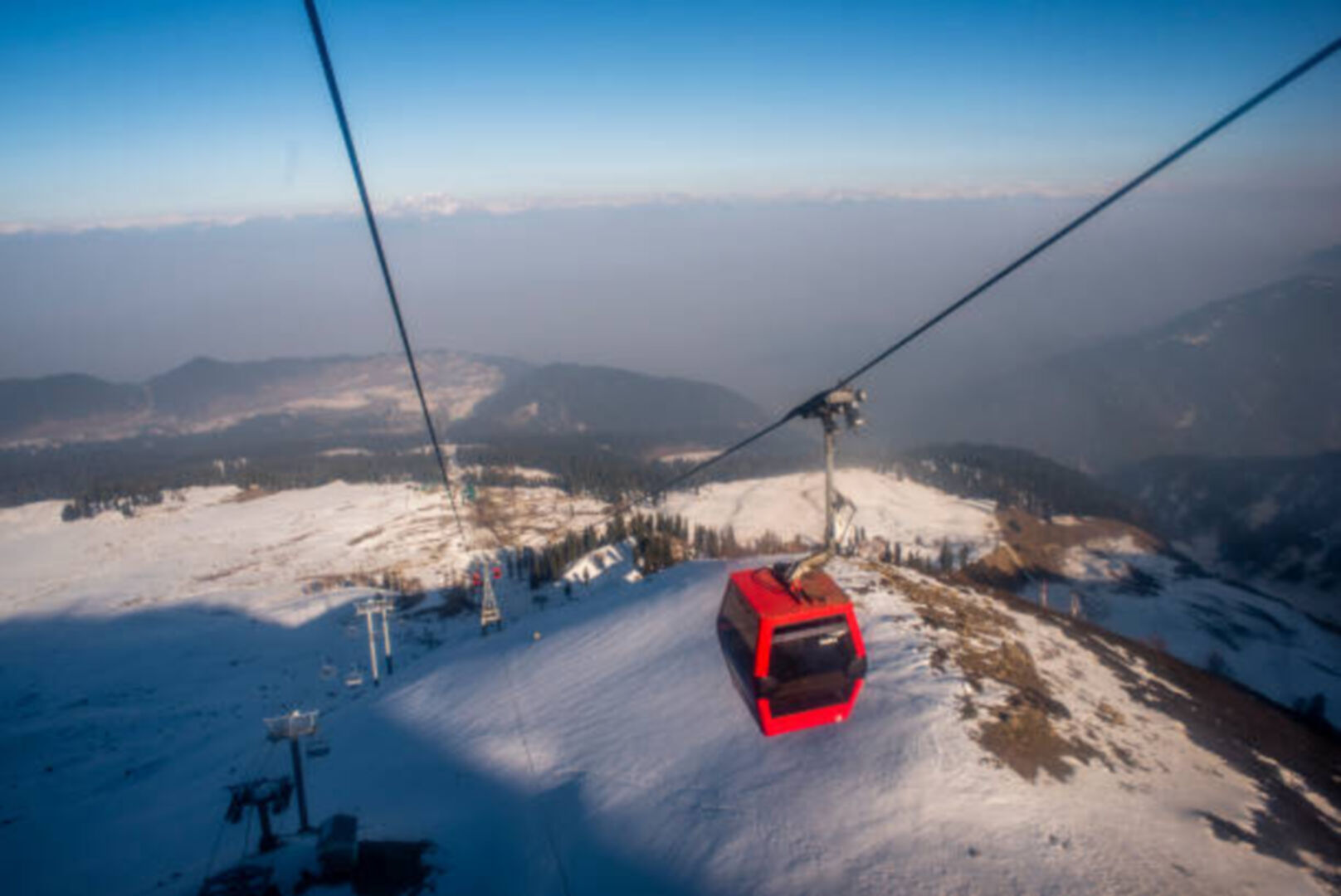 Family at Gulmarg with children playing in snow